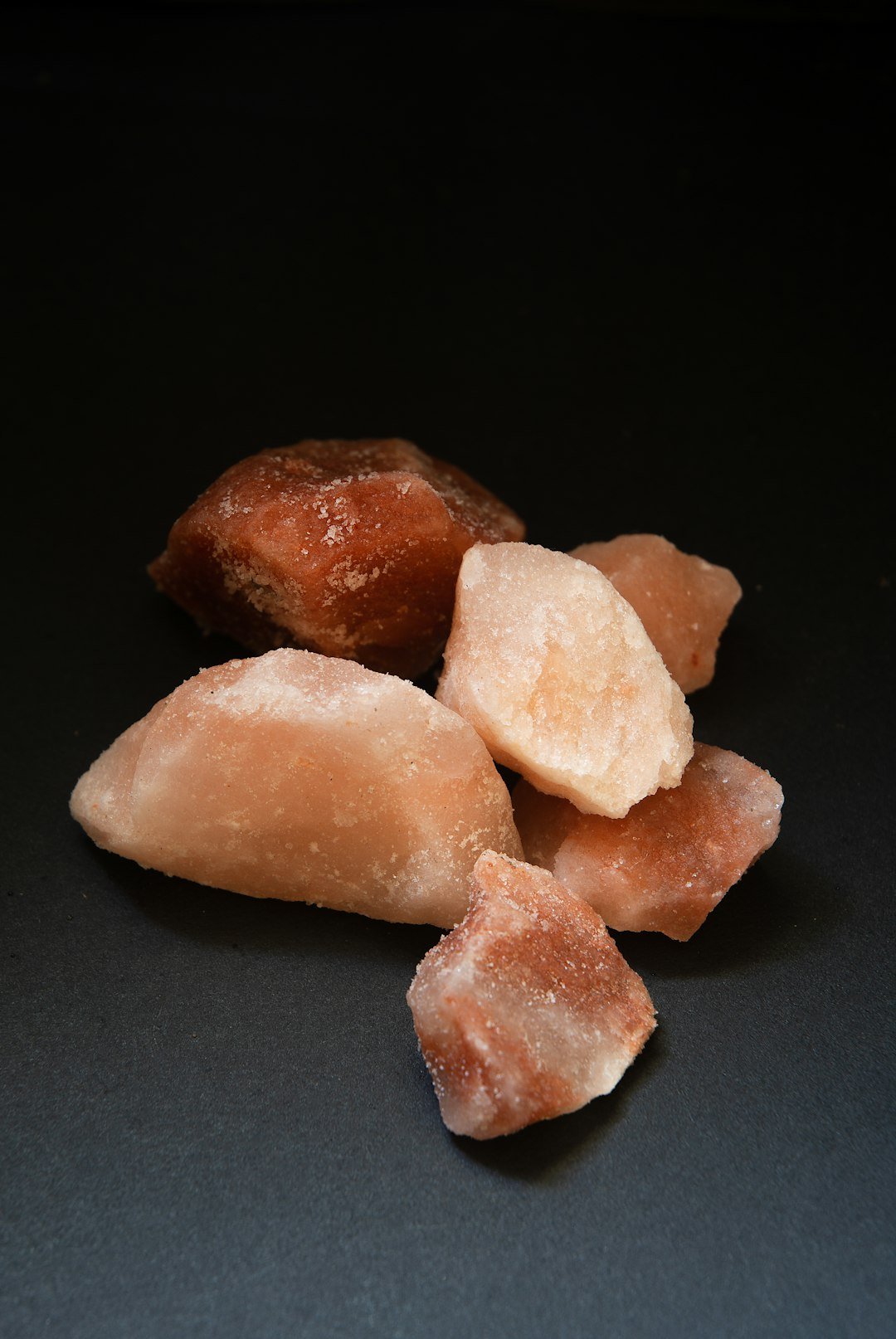 Lumps of natural pink himalayan salt.